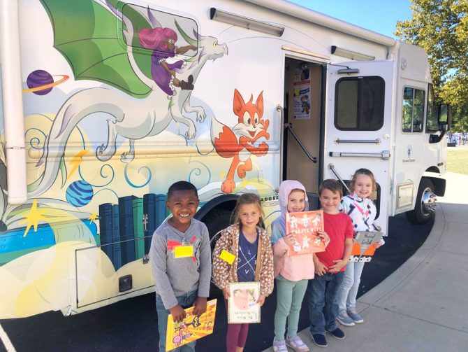 Kids in front of the Bookmobile